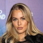Lottie Tomlinson at a public event showcasing her fashion and beauty career.