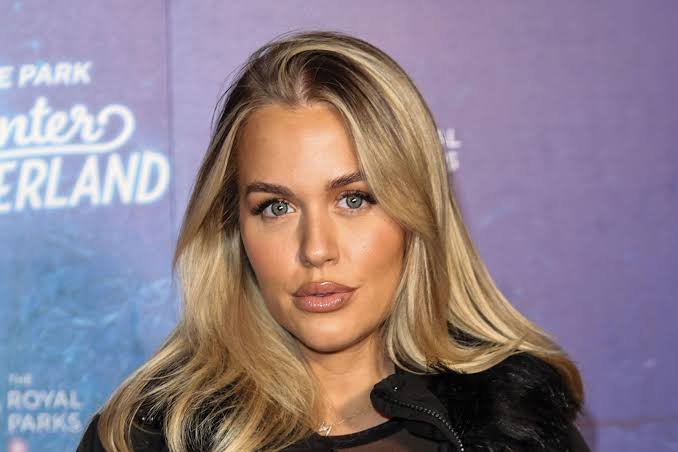 Lottie Tomlinson at a public event showcasing her fashion and beauty career.